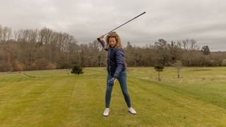 PGA pro Katie Dawkins swinging a golf club