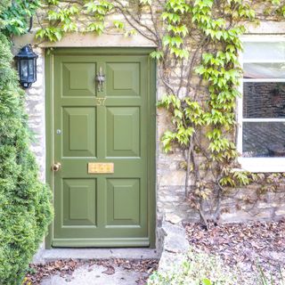 regency style green door in cottage
