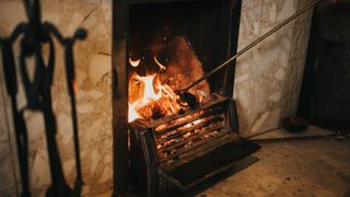 open fire burning in case iron fireplace 