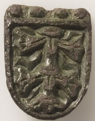 a fragment of a three-lobed brooch