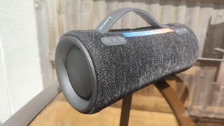 Sony SRS-XG300 review: speaker from the side outside on a table