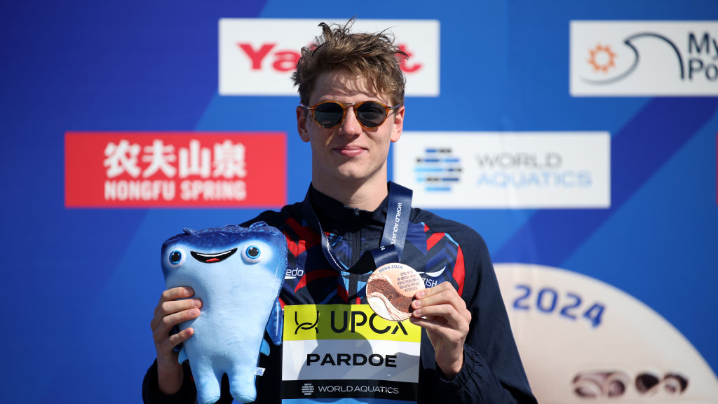 Hector Pardoe of Team Great Britain poses during the medal ceremony for the Men&#039;s Open Water 10km on day three of the Doha 2024 World Aquatics Championships at Doha, where he took bronze