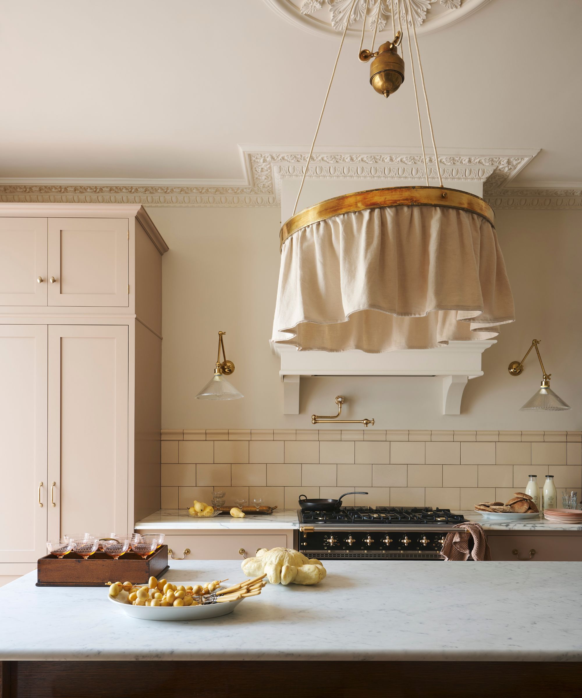 A Victorian kitchen with ornate plaster work on the ceiling