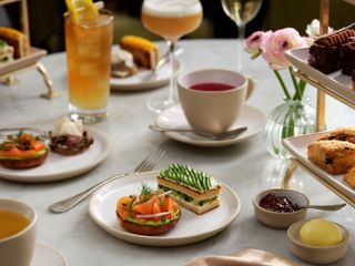 Nomad London afternoon tea with bagels, scones and finger sandwiches