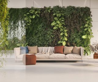 Living wall behind a large, nude sofa