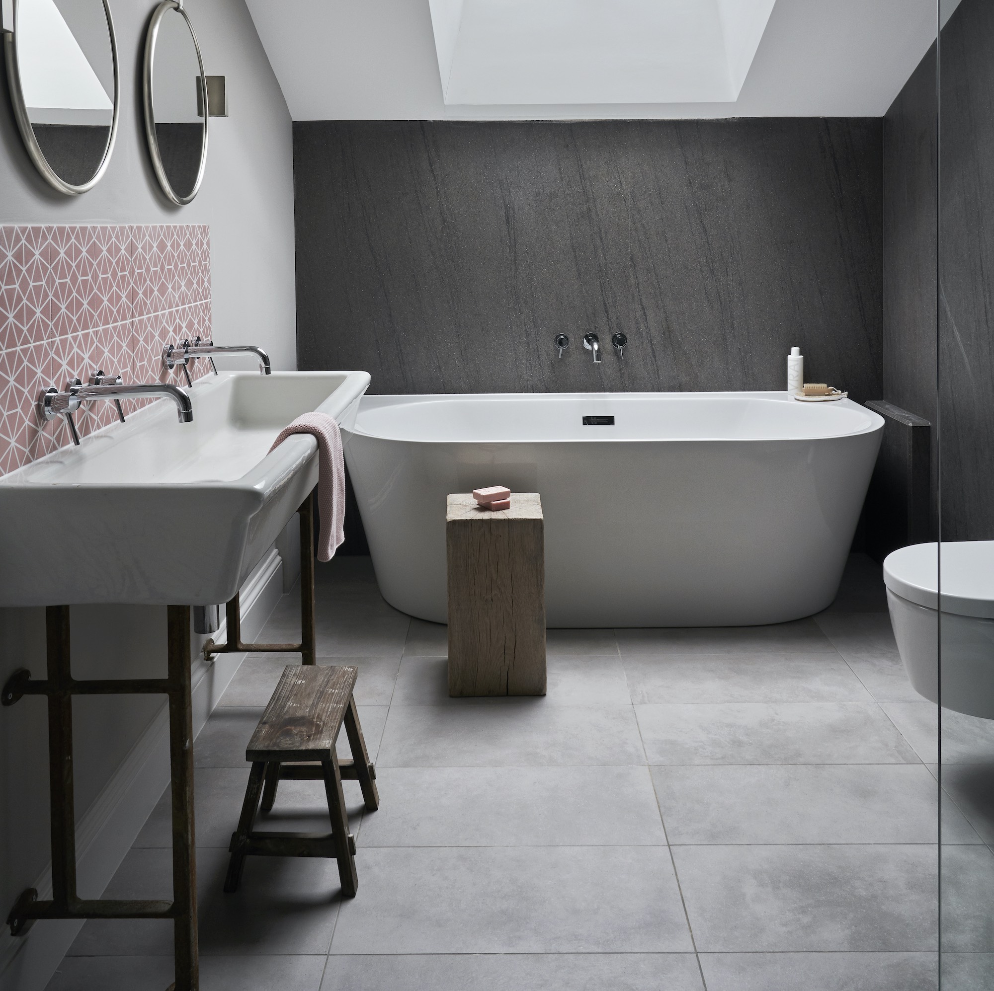 grey and pink bathroom with trough style sink