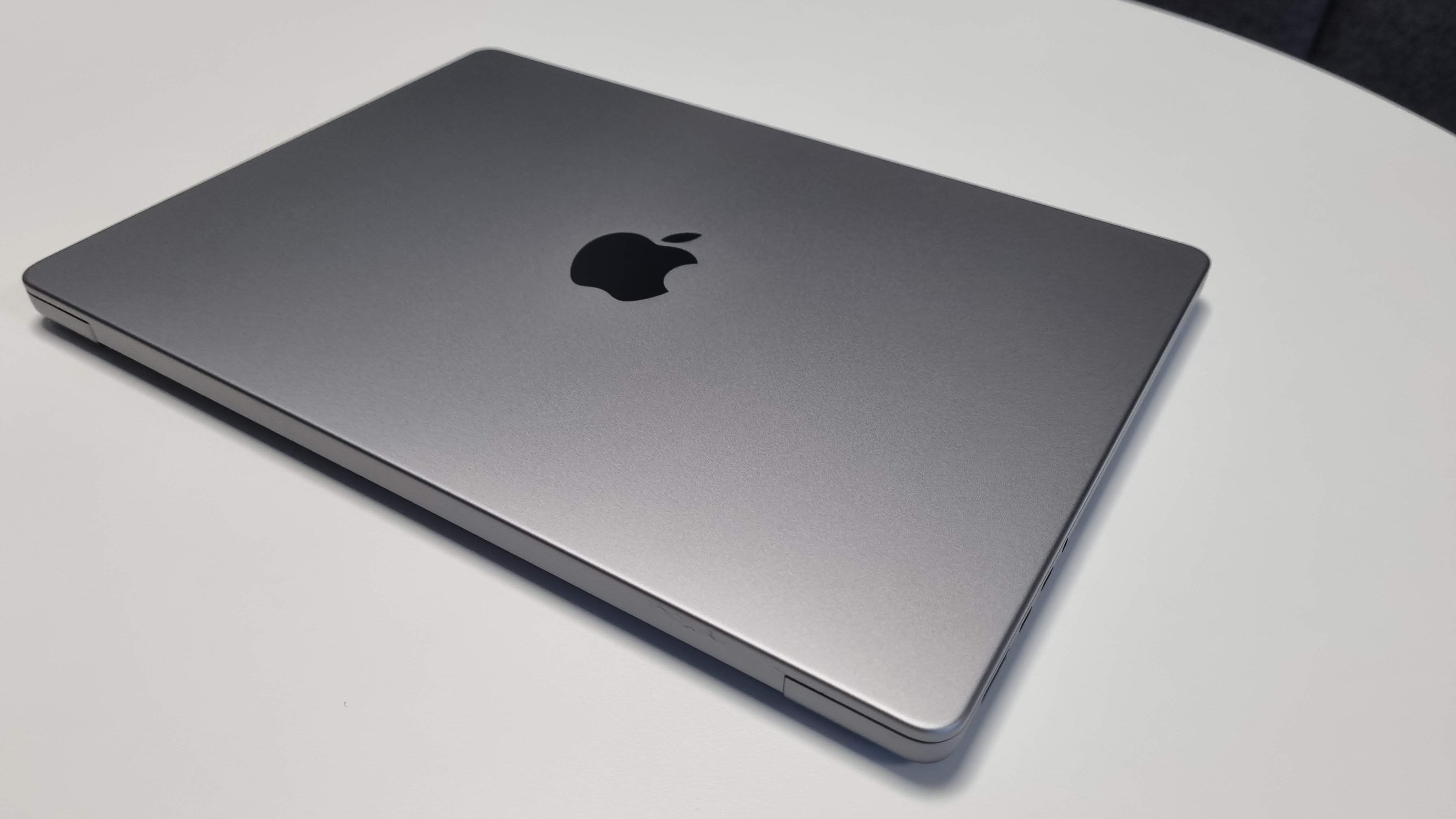 MacBook Pro 14-inch on a table in an office