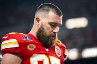 Tight end Travis Kelce #87 of the Kansas City Chiefs walks off the field after the first half during Super Bowl LVIII against the San Francisco 49ers at Allegiant Stadium on February 11, 2024 in Las Vegas, Nevada.