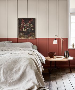 Bedroom paint ideas with terracotta half painted wall with lamp and picture on wall