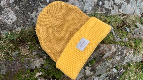 Yellow beanie on a rock