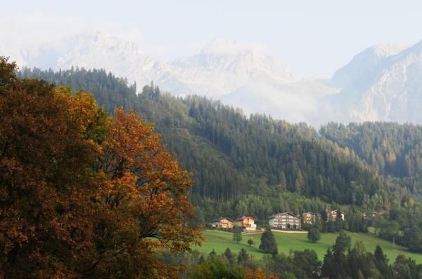 The Alps loom in the foreground of the course