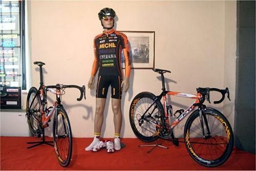 The team bikes and mystery rider