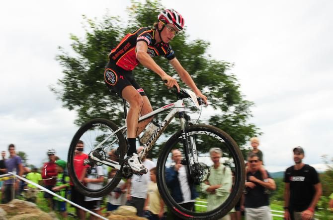 Sepp Kuss (Rocky Mountain Chocolate) flying off one of the jumps