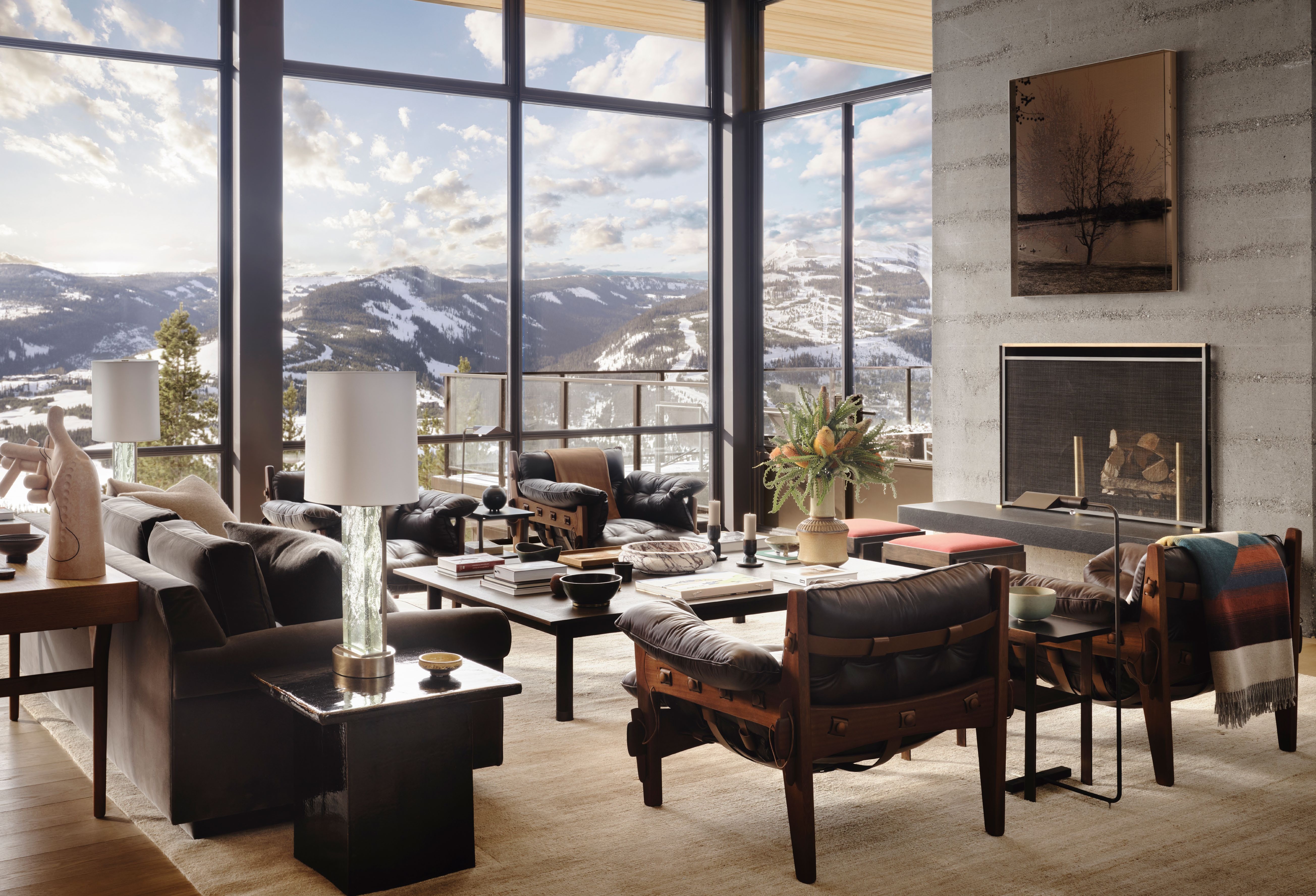 The living room is furnished with ‘Moleca’ lounge chairs by Sergio Rodrigues and custom furniture by Gachot Studios, alongside a stone bowl by Matthew Fisher and a vintage vase sourced from Gallery BAC