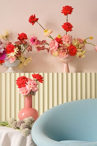 flowers against pink and yellow walls