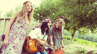hippies singing outdoors in the country