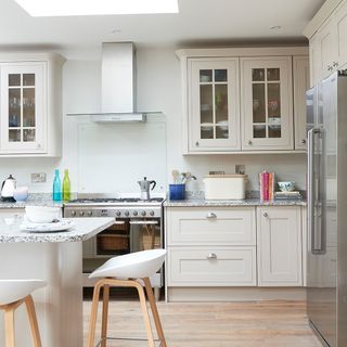 kitchen with white wall and wooden flooring