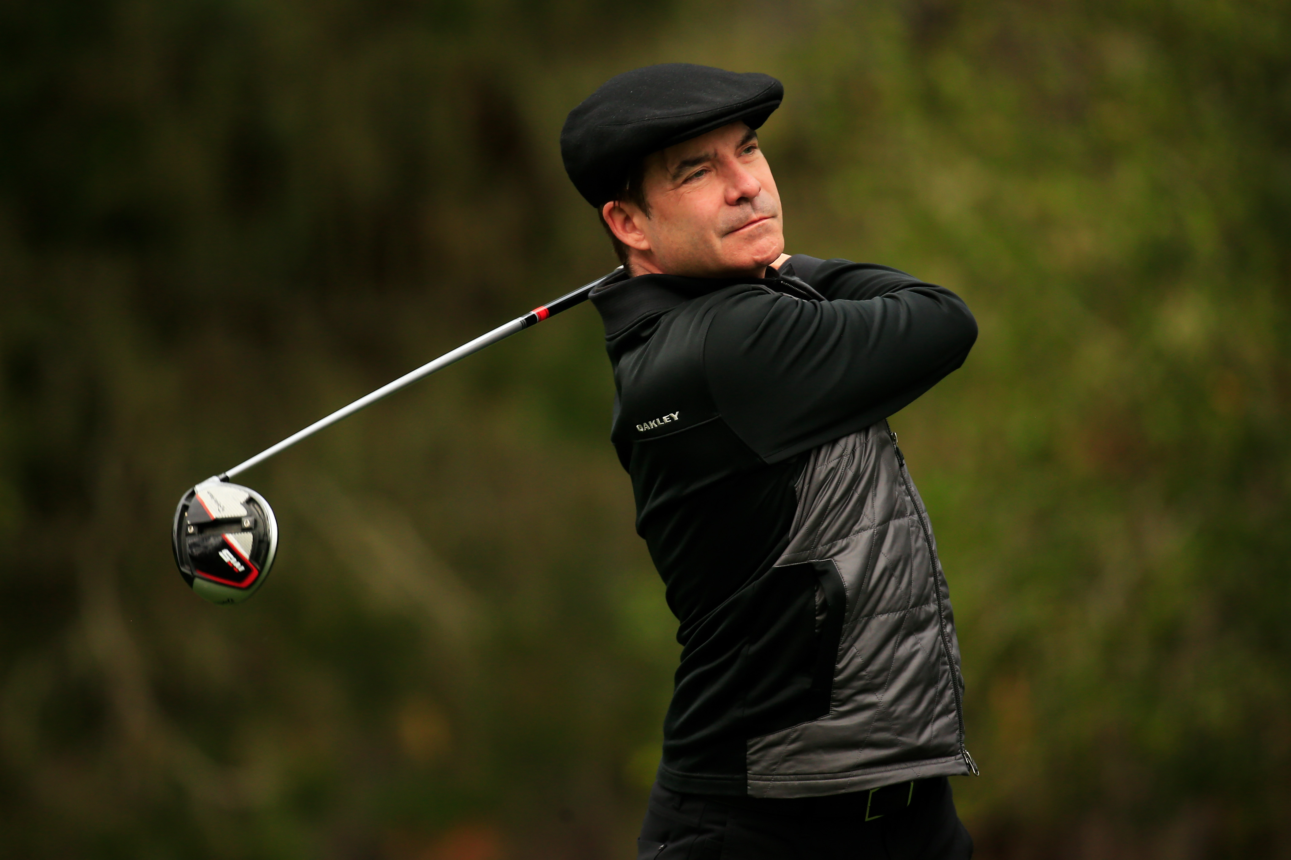 Pat Monahan holds his finish on a drive