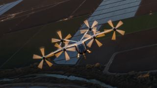 An aerial front view of Joby Aviation's hydrogen-electric air taxi mid-air.