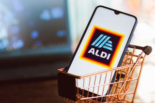 BRAZIL - 2021/09/01: In this photo illustration, an Aldi logo seen displayed on a smartphone along with a shopping cart. (Photo Illustration by Rafael Henrique/SOPA Images/LightRocket via Getty Images)