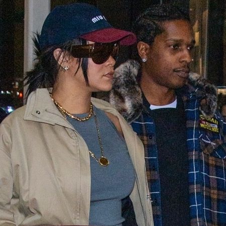 Rihanna wore the naked sandals trend with a Dior bag and camel coat