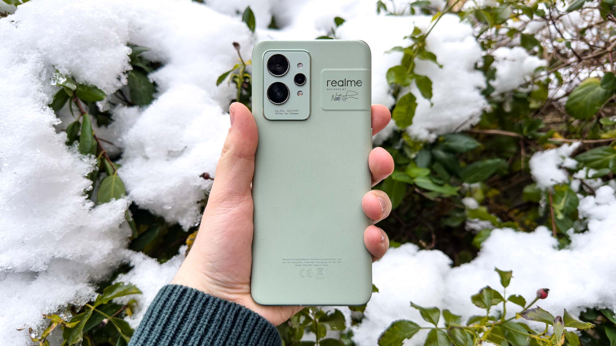 Realme GT 2 Pro in hand, seen from behind