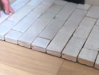 cut tiles around a fireplace