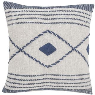 A white and blue patterned throw pillow