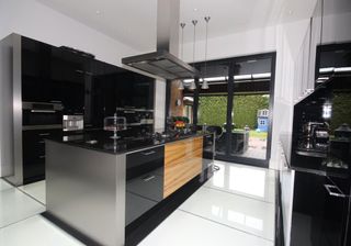 kitchen area with dark worktop and cabinets