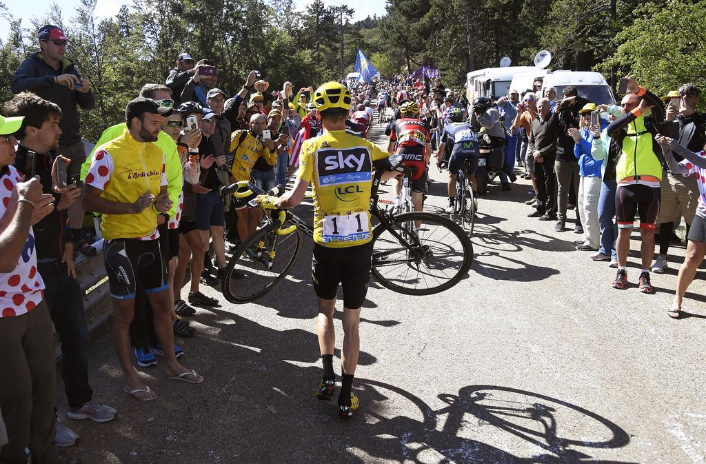 Chris Froome realises his bike is broken after the accident with TV motorbike on Mont Ventoux