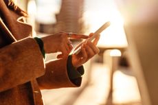 a woman using her smartphone