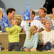 Actress Gwyneth Paltrow (R) and Moses Martin and Apple Martin watch the game between the Arizona Diamondbacks and the Los Angeles Dodgers at Dodger Stadium on September 11, 2013