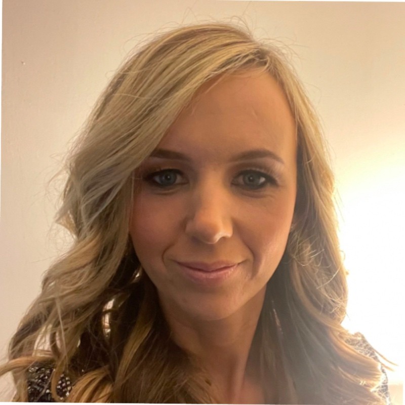 A portrait of a woman with blonde hair