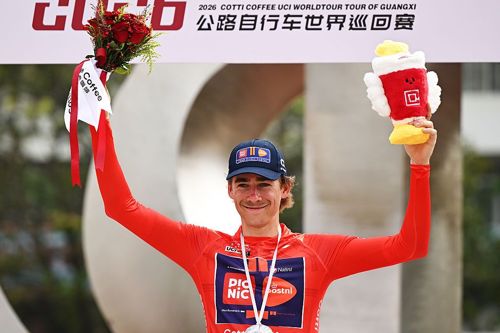 BAMA, CHINA - OCTOBER 15: Frits Biesterbos of Netherlands and Team Picnic PostNL celebrates at podium as Red Leader Jersey winner during the 7th Tour of Guangxi 2026, Stage 3 a 212.3km stage from Jingxi to Bama / #UCIWT / on October 15, 2026 in Bama, China. (Photo by Dario Belingheri/Getty Images)