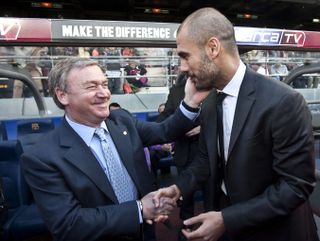 Former Spain coach Javier Clemente congratulates Pep Guardiola on winning La Liga after a game between Barcelona and Valladolid in 2012.