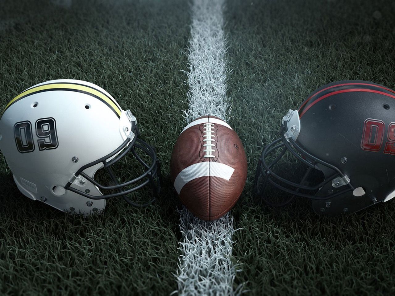 Football Between Two Football Helmets On A Field