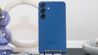 Samsung Galaxy S25 Plus in blue on marble stand