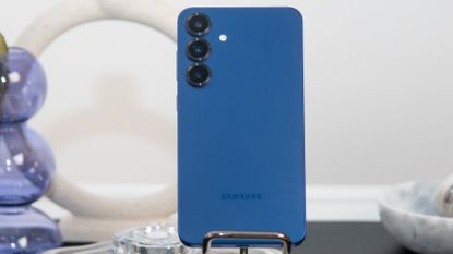 Samsung Galaxy S25 Plus in blue on marble stand