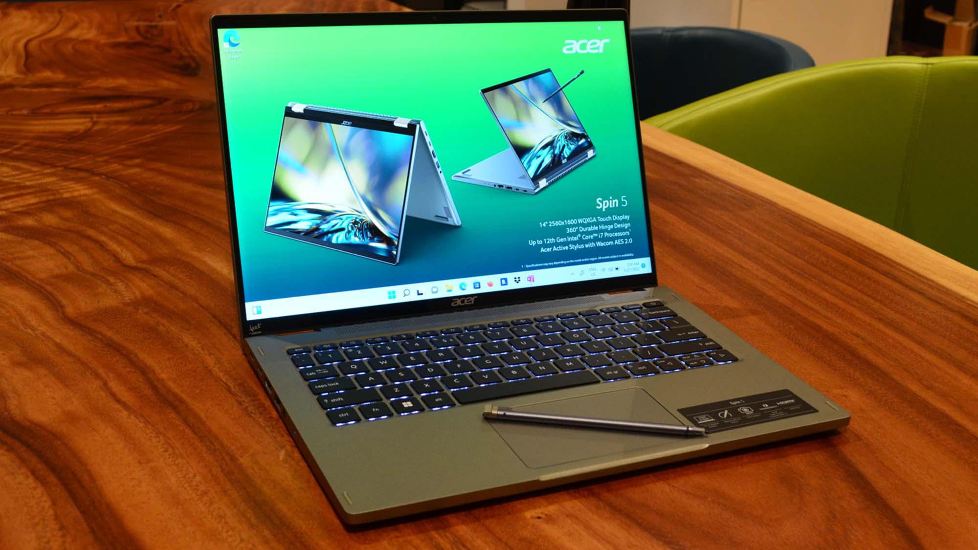 An Acer Spin 5 (2022) on a wood grain table