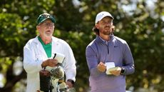 Gray Moore (left) and Tommy Fleetwood consider a shot at The 2024 Masters