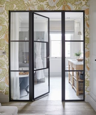 crittall doors dividing a bedroom and ensuite by Sims Hilditch