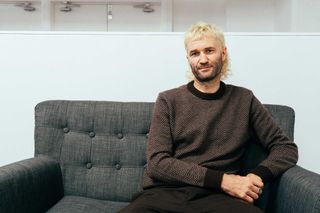 Safa Brian sitting on a sofa at Rouleur Live