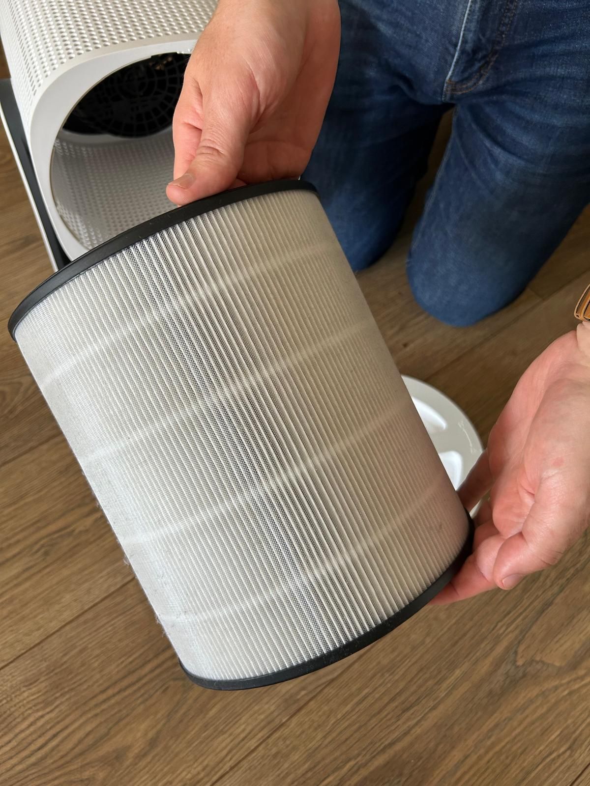 The coway airmega aim air purifier being taken apart