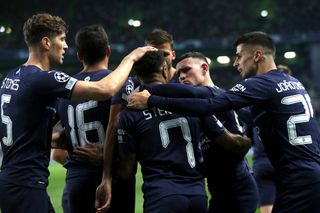 Raheem Sterling, centre, and City celebrate their fifth goal