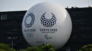 How to watch the Tokyo Paralympics - Image shows Tokyo 2020 logos on the Hinomaru driving school