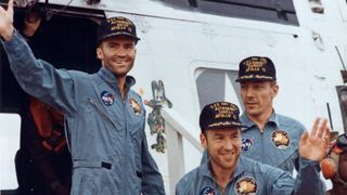 The crew of Apollo 13 aboard the USS Iwo Jima after recovery from the Command Module.