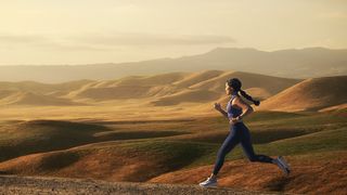 Woman running on desert trail