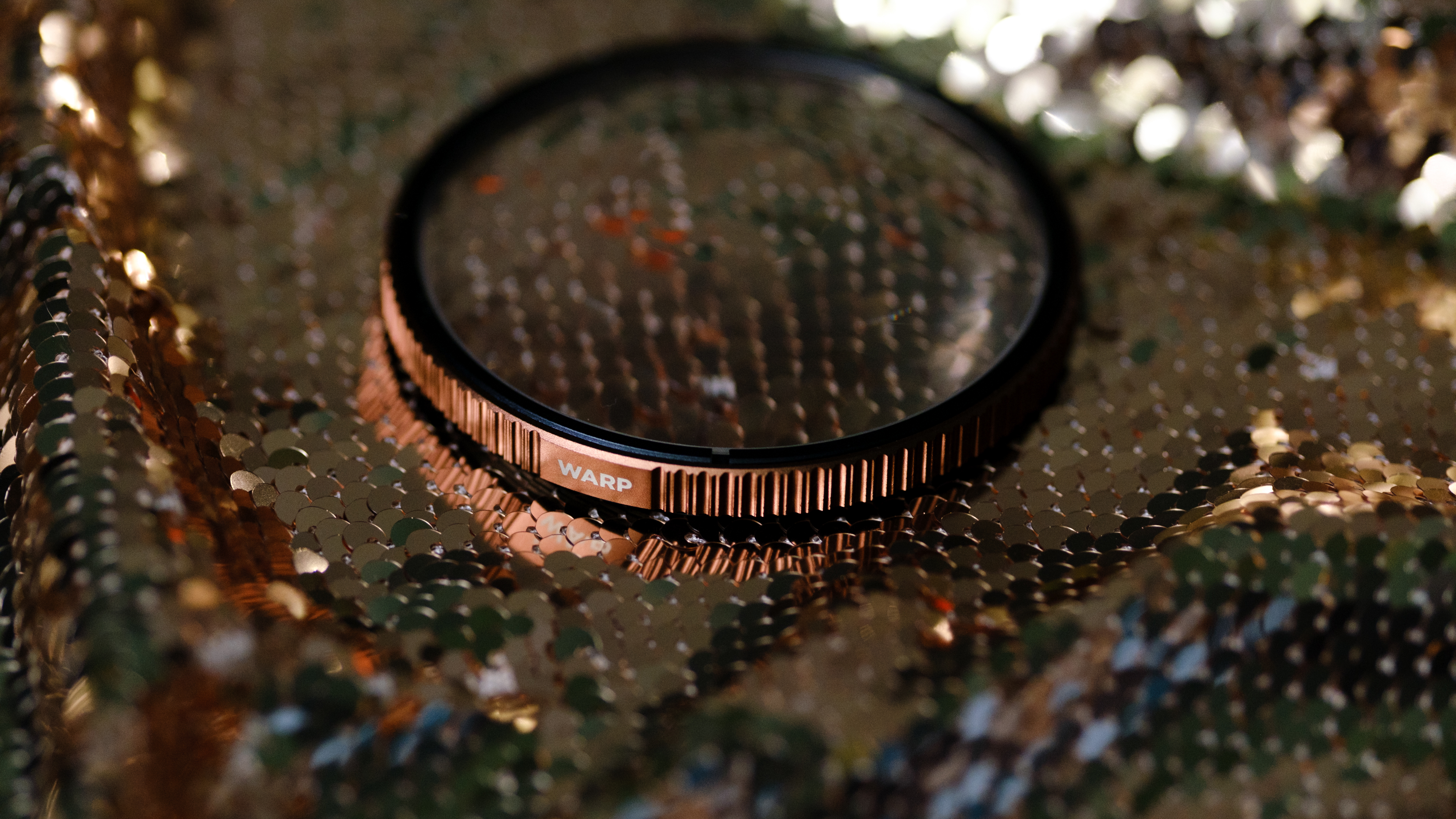 The PolarPro Warp filter on a gold background