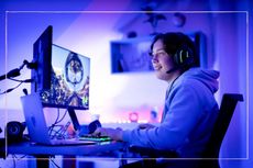Teenager online gaming in bedroom