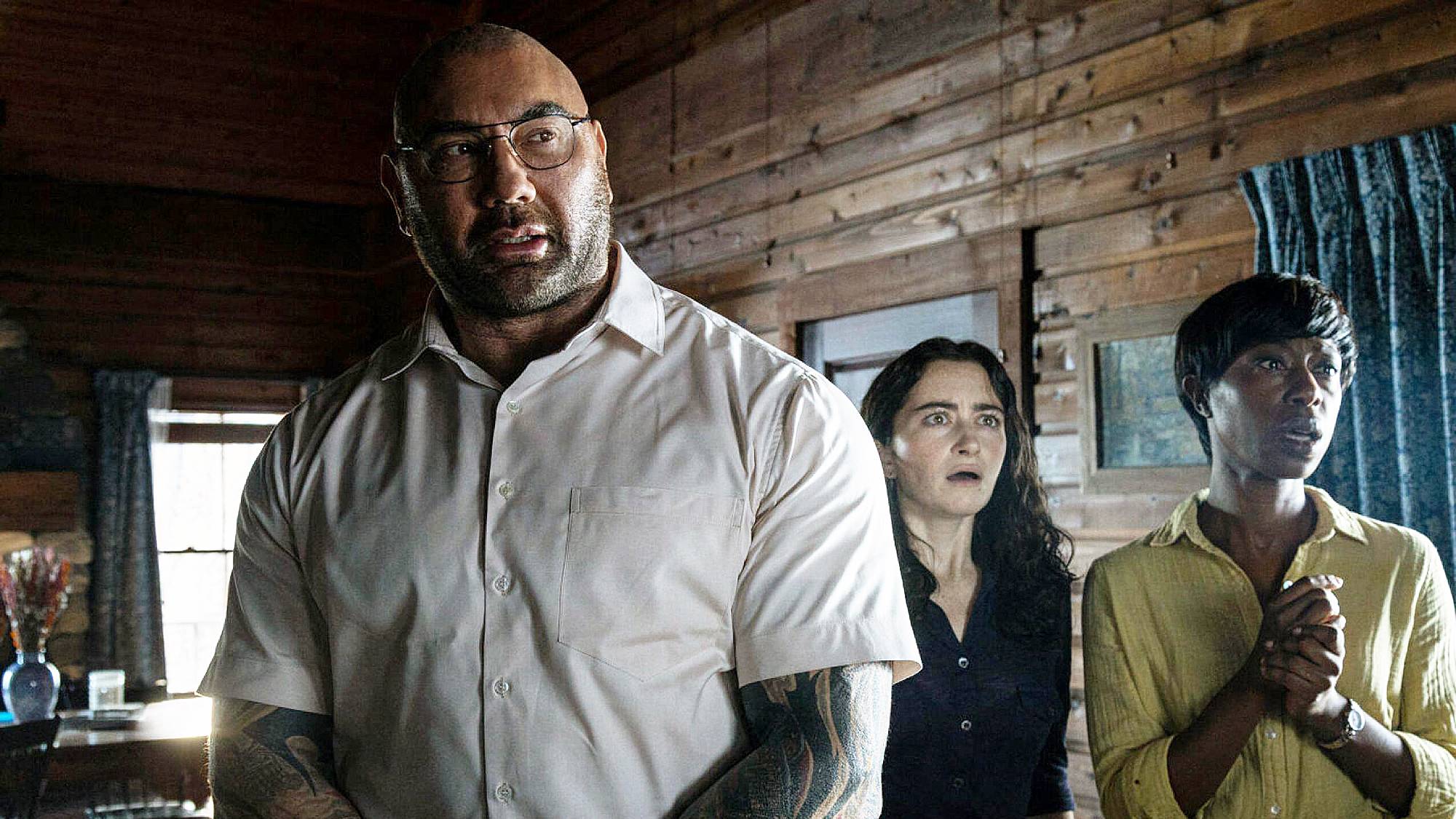 Dave Bautista, Abby Quinn, and Nikki Amuka-Bird in "Knock at the Cabin" movie (2023)